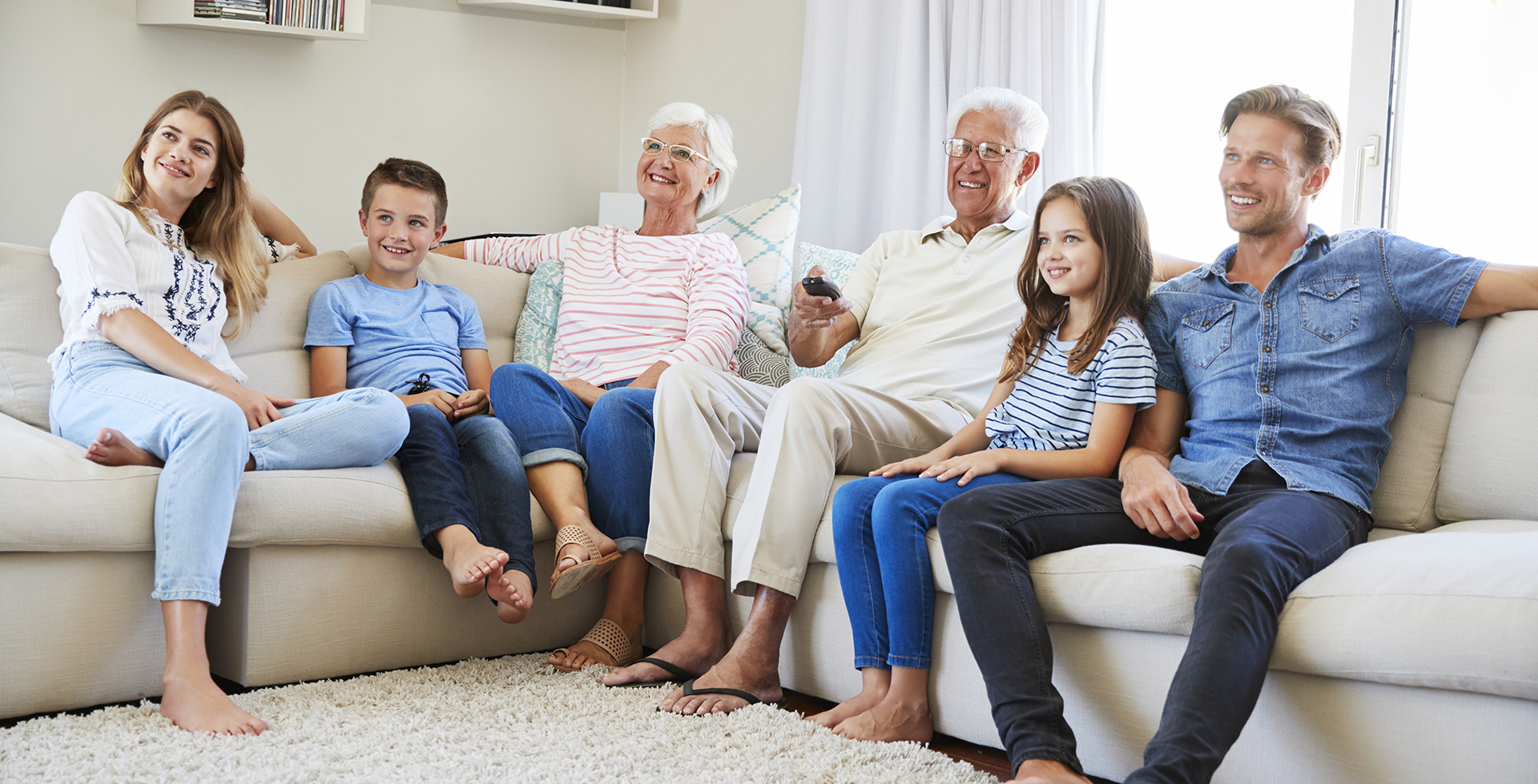Multi-Generational Family Watching Home Videos - Media Transfer Pros