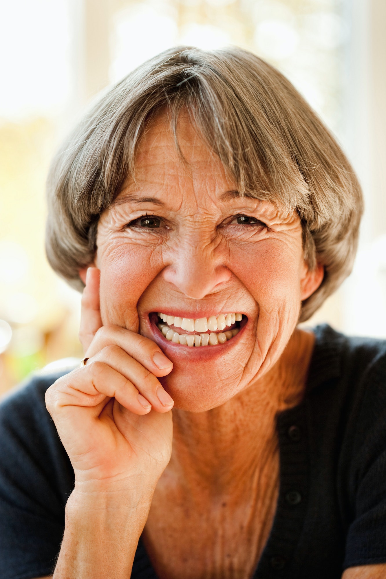 Old woman smiling at viewer