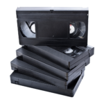 VHS tapes transferred to mp4 in a stack for transfer- mediatransferpros.com